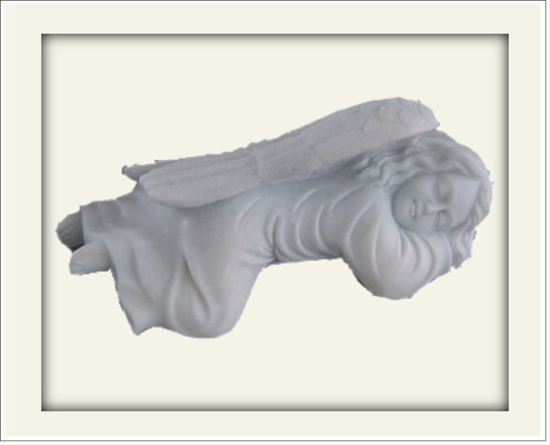Statue of a sleeping angel lying on her stomach